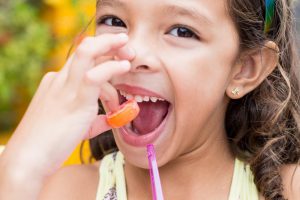 kid eating candy