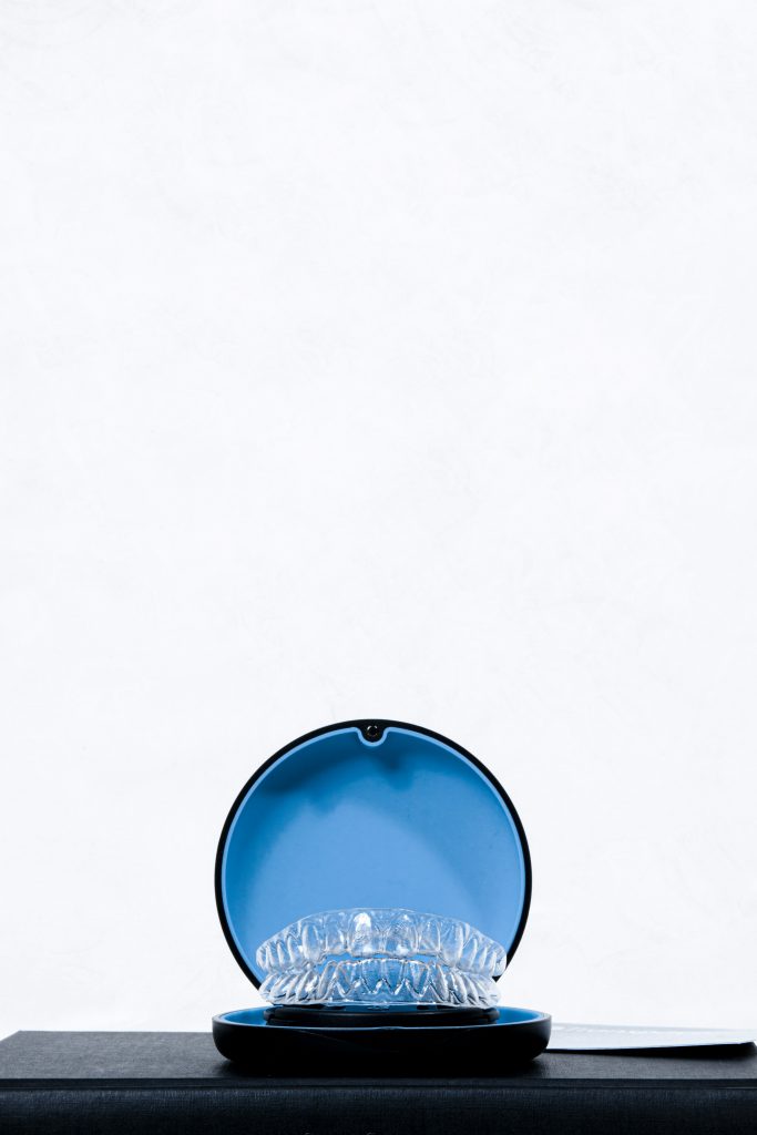 dental aligners in a blue black case